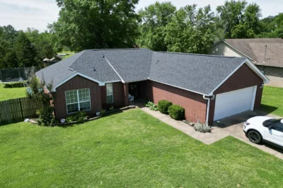 Red Brick Home Dark Grey Shingle Roof Replacement Nwa