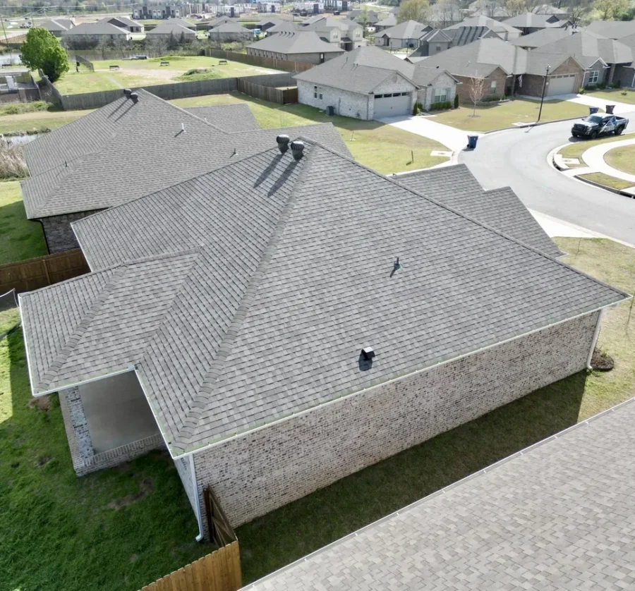 Aerial view of a finished asphalt shingle roof replacement by Foster Roofing on a home in Fort Smith, Arkansas