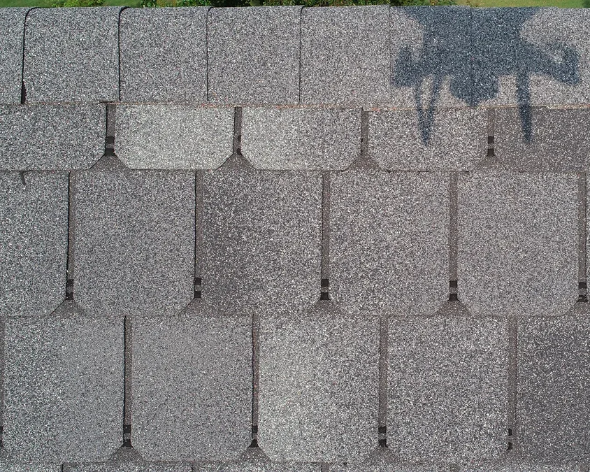 Drone close-up of asphalt shingles on a residential roof, part of a Foster Roofing drone roof inspection