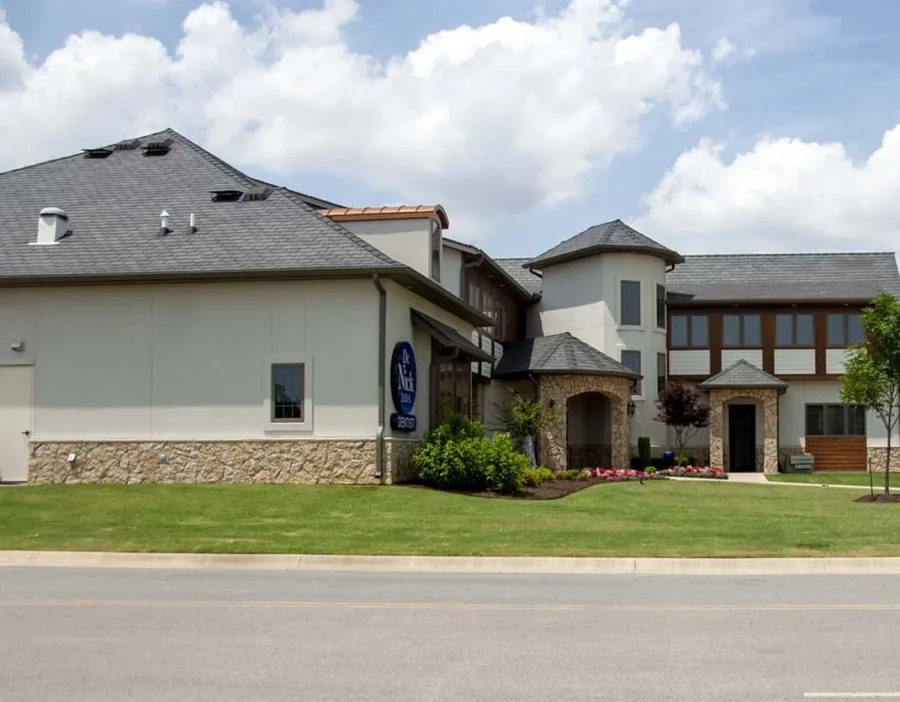 Gray shingle roof on the Dr. Nick DDS dental office in Rogers, Arkansas, a Foster Roofing commercial roofing project